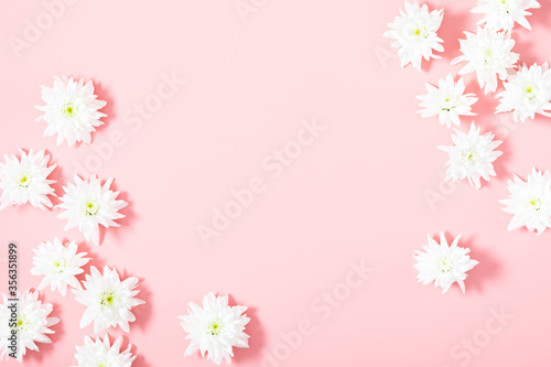 Beautiful flowers composition. White flowers on pastel pink background. Flat lay, top view, copy space