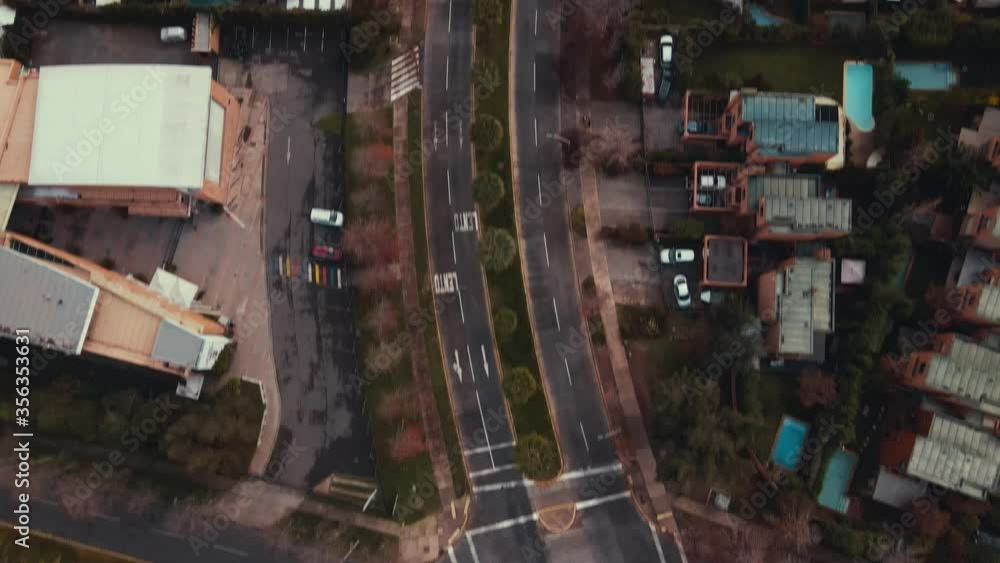 Satellite view following main road with palms and traffic at golden hour on the suburbs of Santiago-4K Satellite view following main road with palms and traffic at golden hour on the suburbs of Santiago-4K