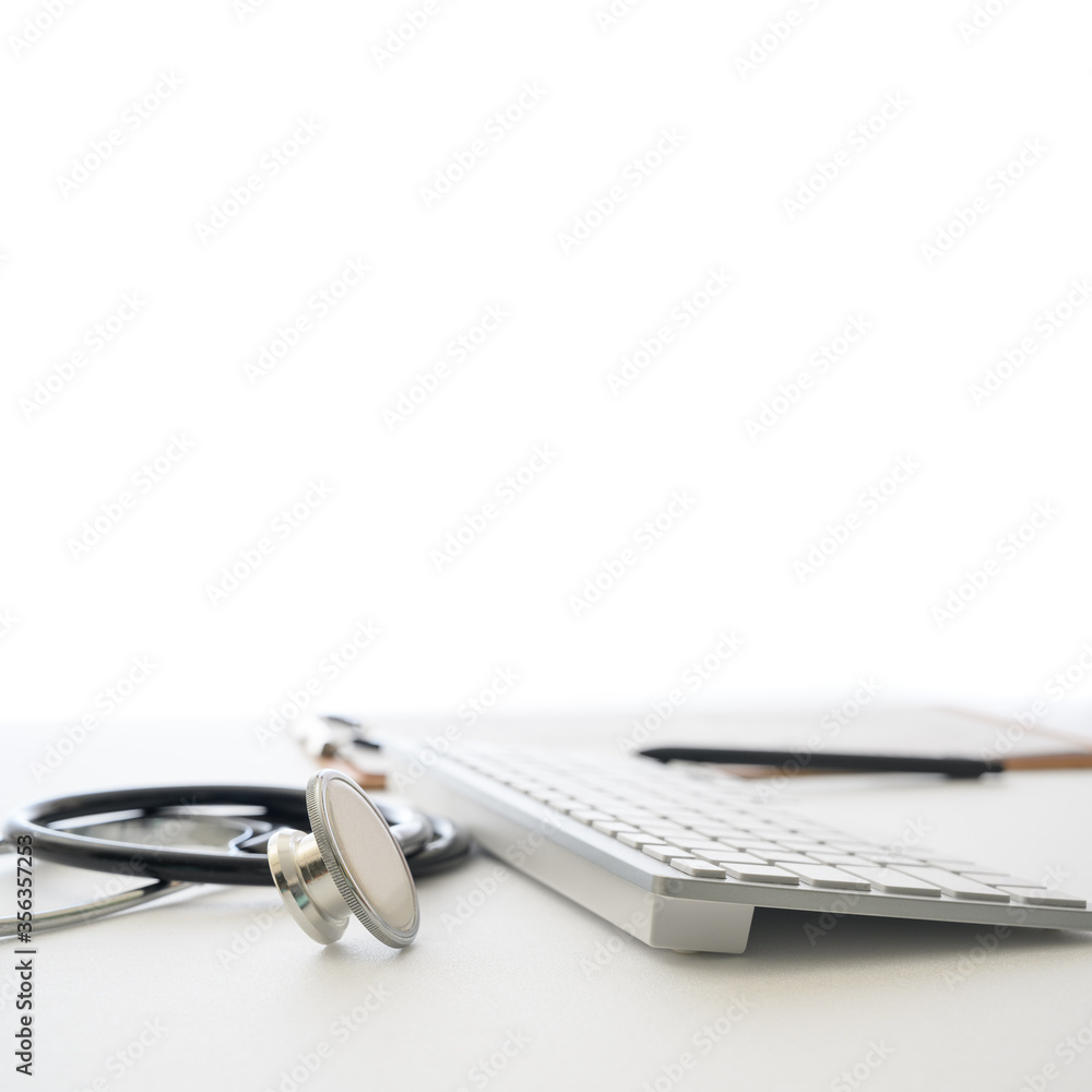 Medical concept with stethoscope and computer keyboard in white margin. Medical concept with stethoscope and computer keyboard in white margin.