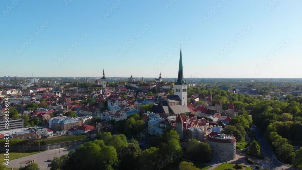 Tallinn, Estonia. Aerial Shot of Medieval Old Town, St. Nicholas' Church, St. Olaf's Church and Walls of Tallinn. Beautiful view of ancient architecture of Tallin city. UNESCO Tallinn, Estonia. Aerial Shot of Medieval Old Town, St. Nicholas' Church, St. Olaf's Church and Walls of Tallinn. Beautiful view of ancient architecture of Tallin city. UNESCO