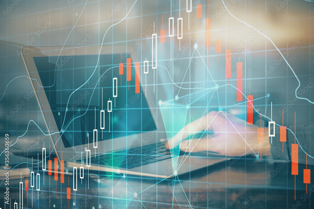 Double exposure of stock market graph with man working on laptop on background. Concept of financial analysis. Double exposure of stock market graph with man working on laptop on background. Concept of financial analysis.