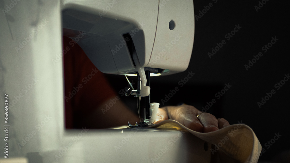 Worker on sewing machine