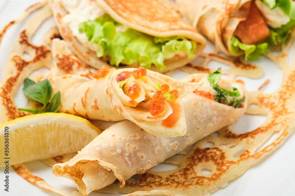 Russian pancakes with salmon and red caviar Russian pancakes with salmon and red caviar