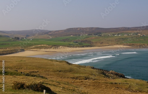 The deserted Armadale Bay and surrounding countryside on the North Coast of Scotland. photo