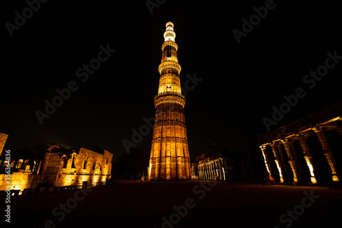 Illuminated Qutub Minar at Night, Delhi, India photo