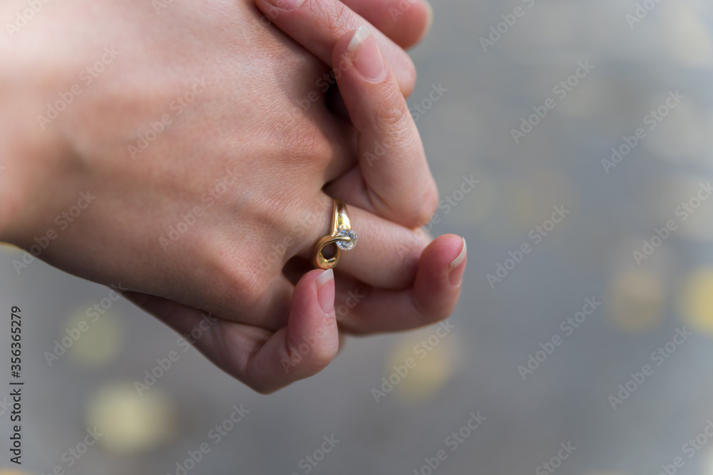 Girl's hand with gold ring