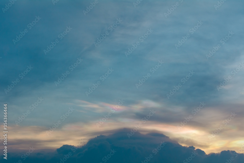 iridescent clouds in the evening before the sunset. iridescent clouds in the evening before the sunset.