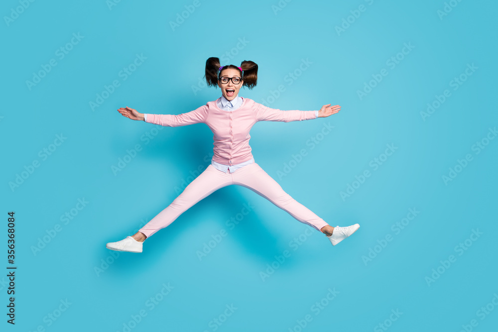 Full length photo of crazy cheerful funny teen high school student jump hold hand wear good look outfit shoes isolated over blue color background