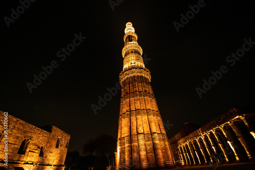 Illuminated Qutub Minar at Night, Delhi, India photo