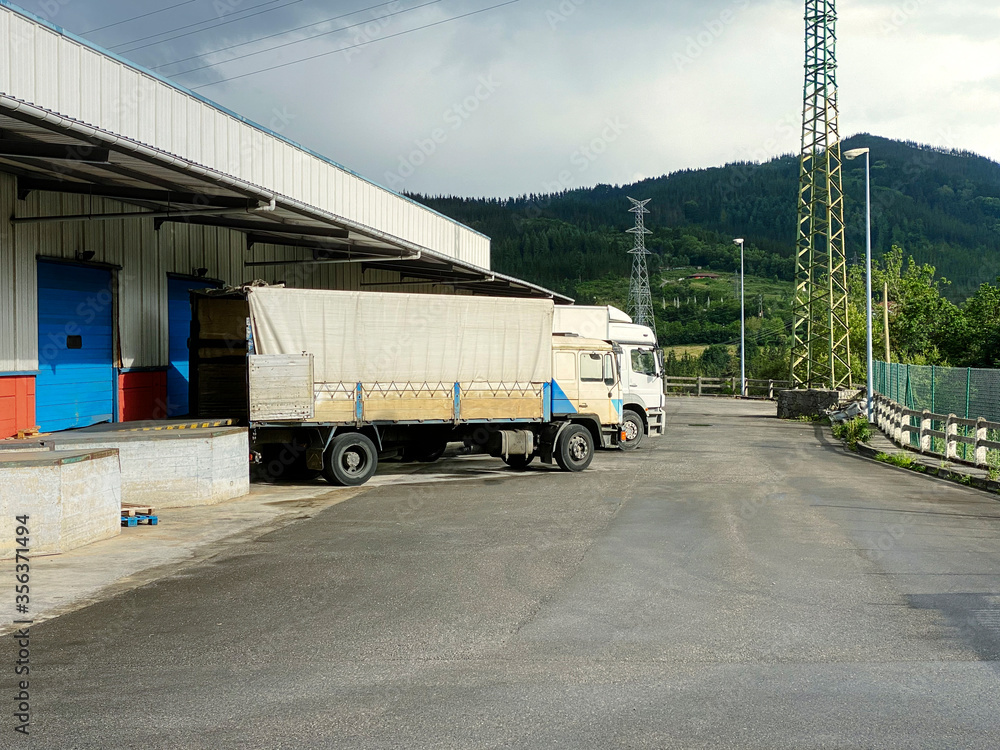 Trucks being loading in a factory