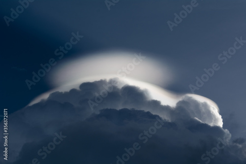 UFO shaped clouds above the Cumulonimbus clouds