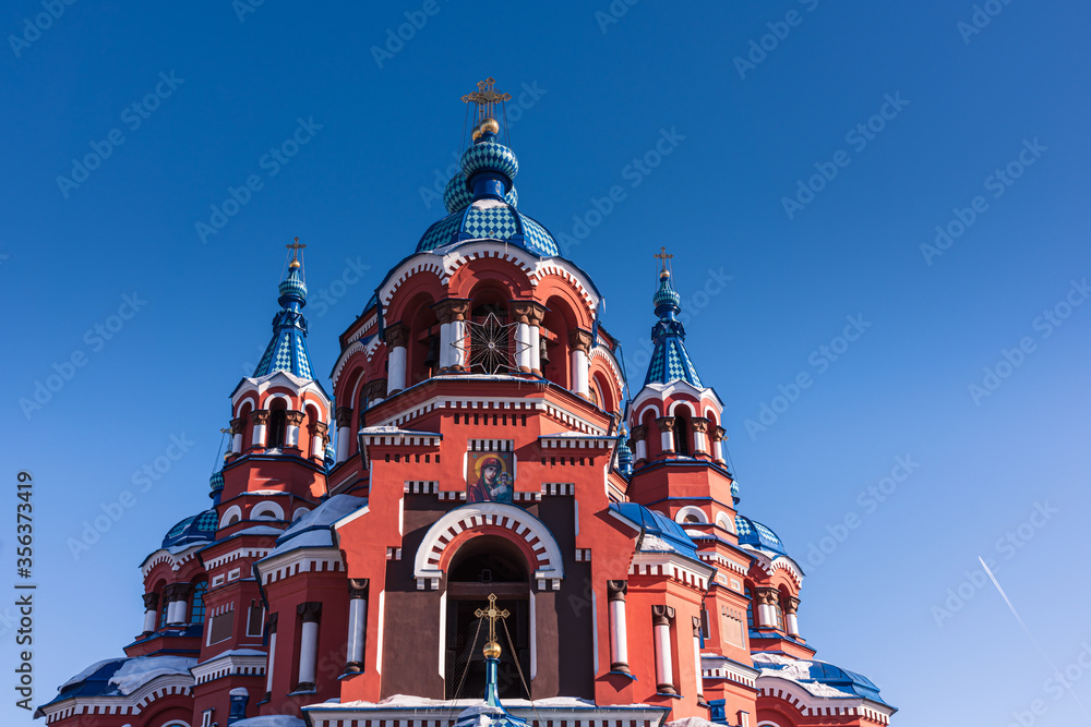 Fototapeta premium Beautiful view of Kazan Church an iconic Orthodox church in the city of Irkutsk, Russia. Kazan Icon of the Mother of God. It is known for the Irkutsk’s largest church bell.