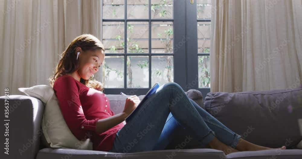 Mixed race woman enjoying her time at home. Social distancing and self isolation in quarantine Mixed race woman enjoying her time at home. Social distancing and self isolation in quarantine