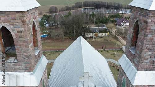 Drone shot on Catholic church of St. Iosif in Rubegevich, Belarus. Aerial view on catholic church architecture.
 photo