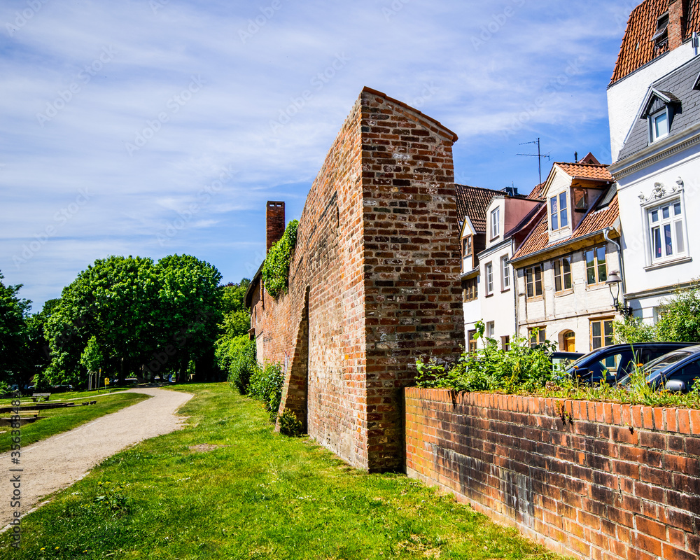 Lübeck the old city wall and behind it lies the old town with its historic facades