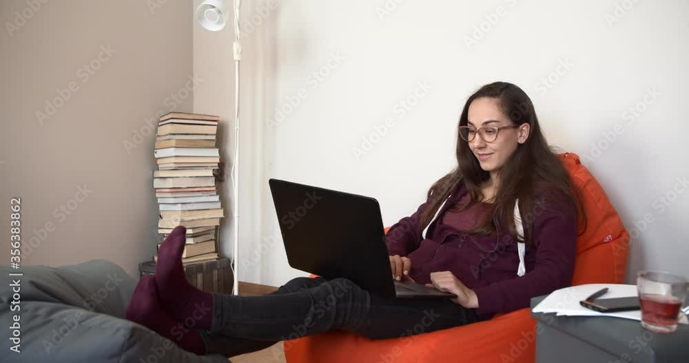 The freelancer talks to the client via a laptop via video link. Work from home The freelancer talks to the client via a laptop via video link. Work from home