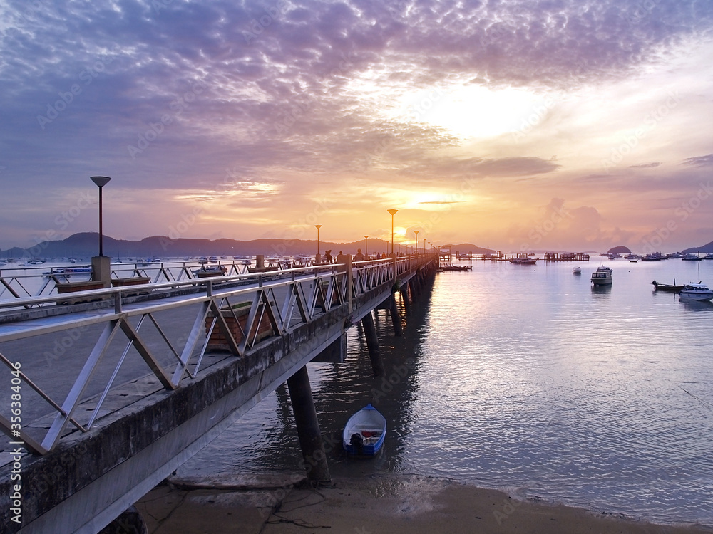 beach sunset on the bridge at Rawai port in Phuket Thailand