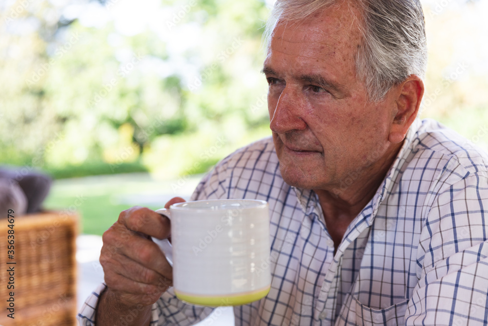 Caucasian senior drinking coffee at home Caucasian senior drinking coffee at home