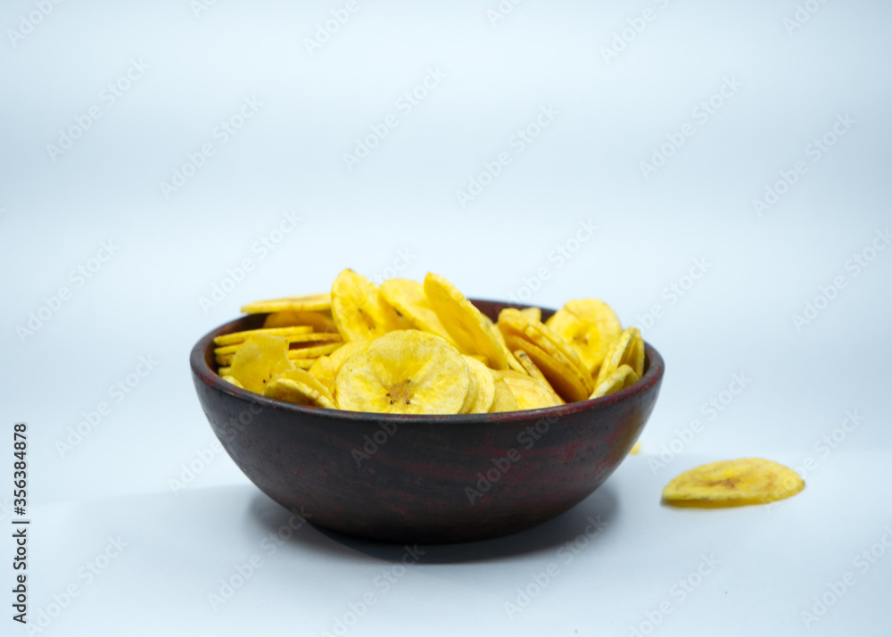 Tasty banana chips in a bowl with nice colur, spicy, crispy, salt. Tasty banana chips in a bowl with nice colur, spicy, crispy, salt.