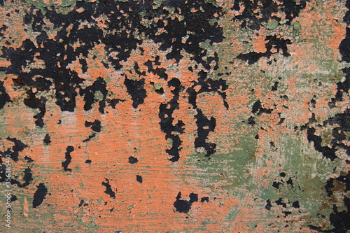 Rusty, orange surface of weathered iron plate, machine. © Primus_1