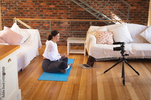 Plus size female vlogger self isolating at home  photo