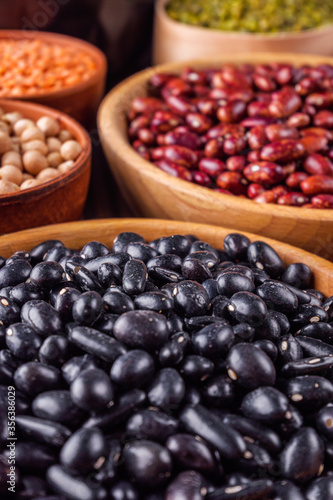 Fresh organic natural beans on wooden rustic background