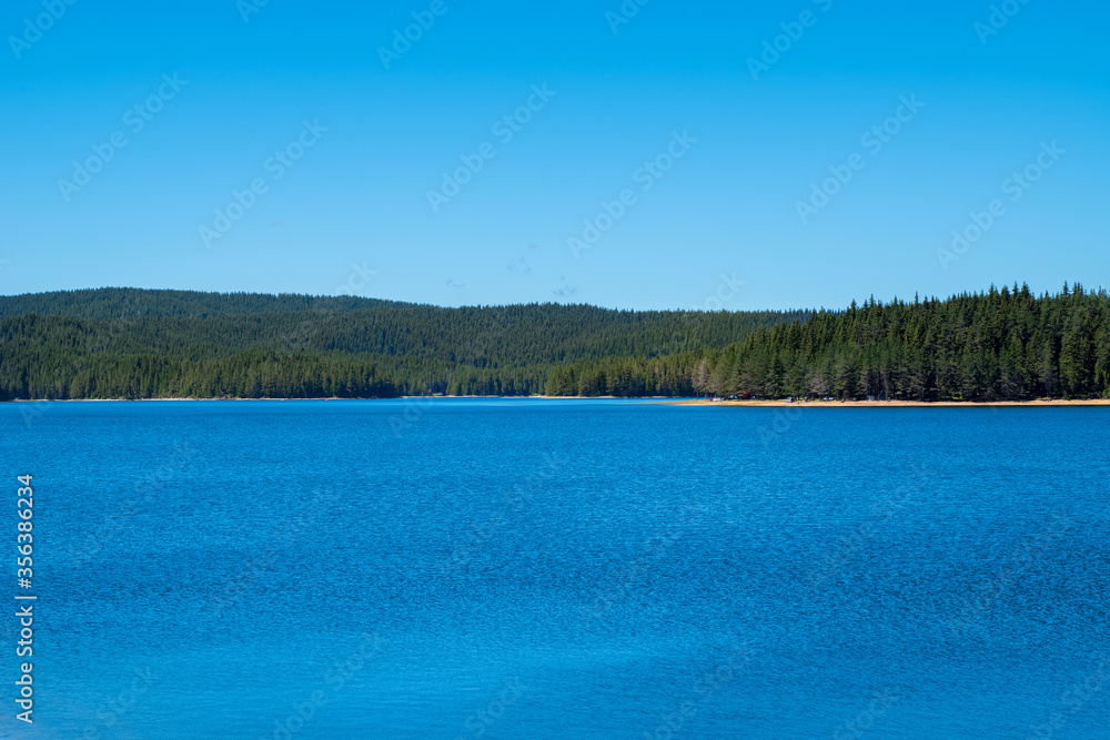 Blue dam with clear sky