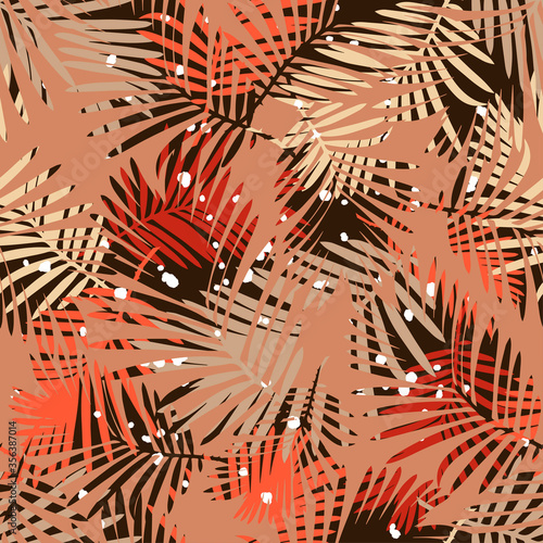 Seamless pattern with decorative palm leaves with dots. On top of the drawing is a background of leaves. Vector illustration for web design or print.