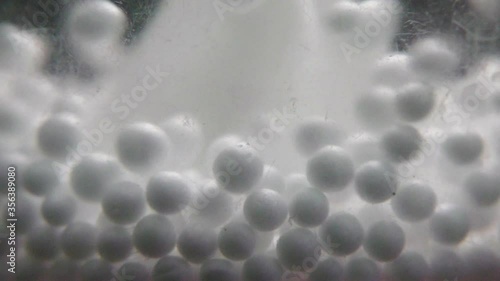 Wallpaper Mural Bouncing white balls inside transparent jar Torontodigital.ca