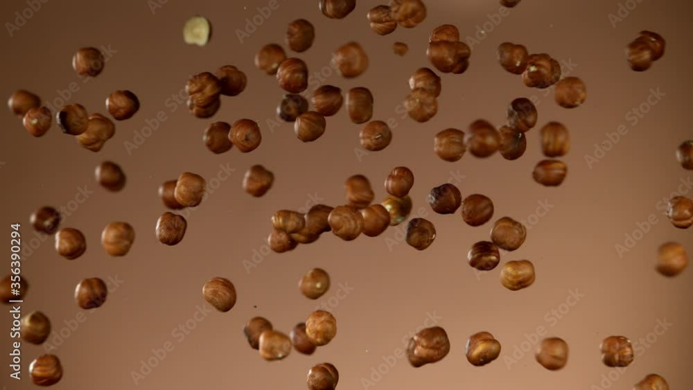 Super slow motion of flying hazelnuts collision. Filmed on high speed cinema camera, 1000 fps. Super slow motion of flying hazelnuts collision. Filmed on high speed cinema camera, 1000 fps.