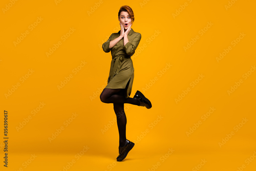 Full length body size view of her she nice attractive lovely charming amazed stunned cheerful cheery girl jumping having fun isolated on bright vivid shine vibrant yellow color background