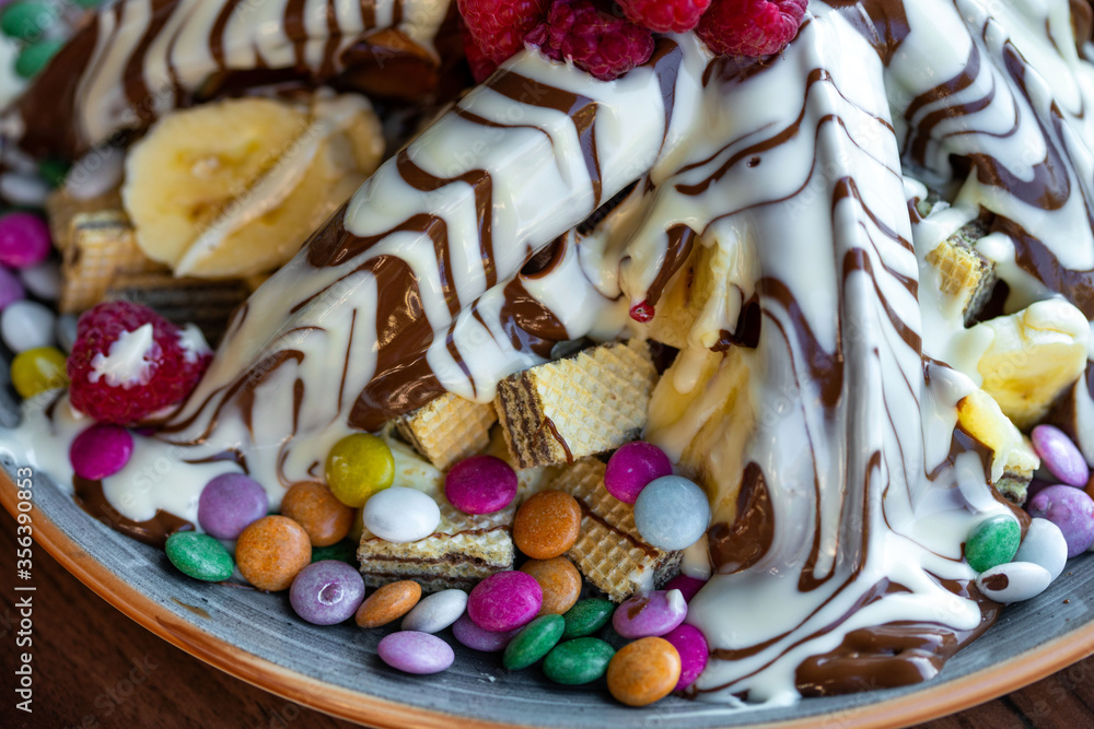 Sweet Waffles with milk chocolate, white chocolate, vanilla cream, strawberries, banana, vanilla ice cream sweet popcorn Sweet Waffles with milk chocolate, white chocolate, vanilla cream, strawberries, banana, vanilla ice cream sweet popcorn