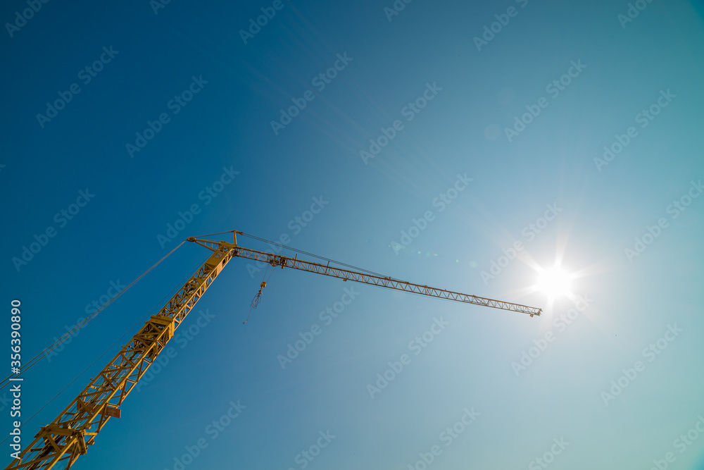 Yellow crane and blue sky