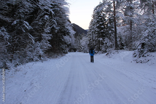 Lost, alone woman walking at the end of the day toward home.