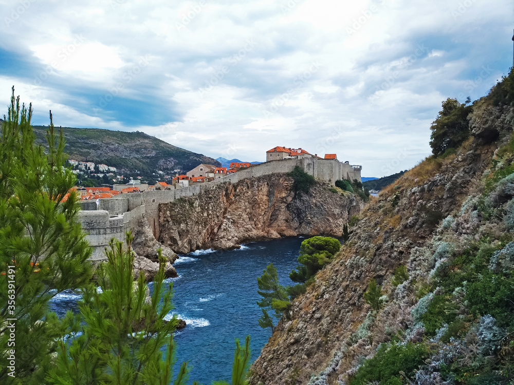 Scenic view on the old city center of Dubrovnik, Croatia, old city background with old stone wall, amazing landscape with adriatic sea 