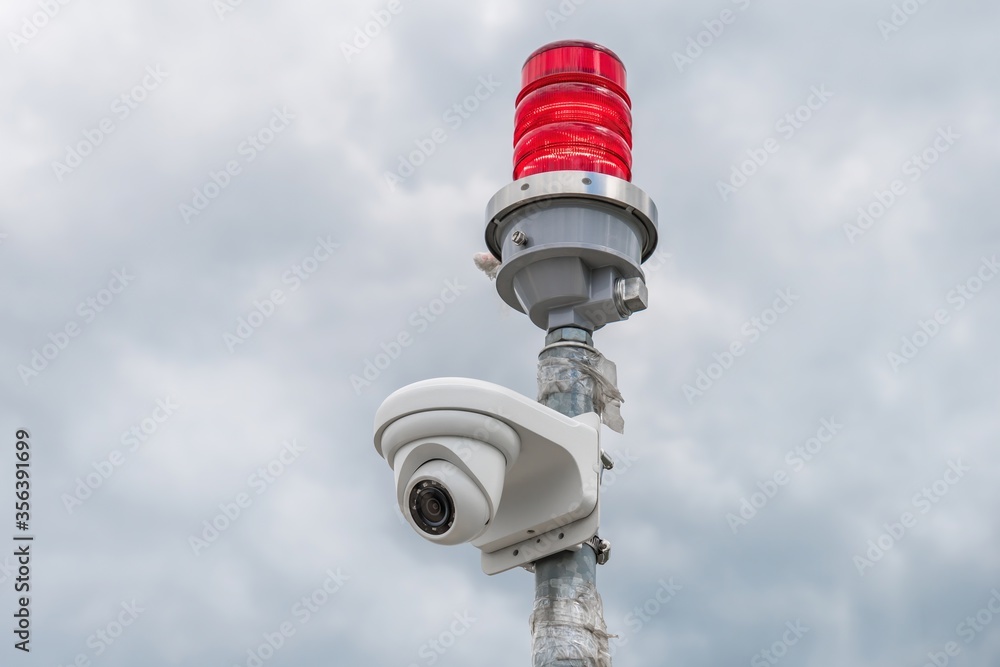 Security camera with red beacon