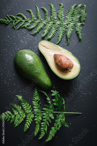 Fresh raw avocado on dark b...