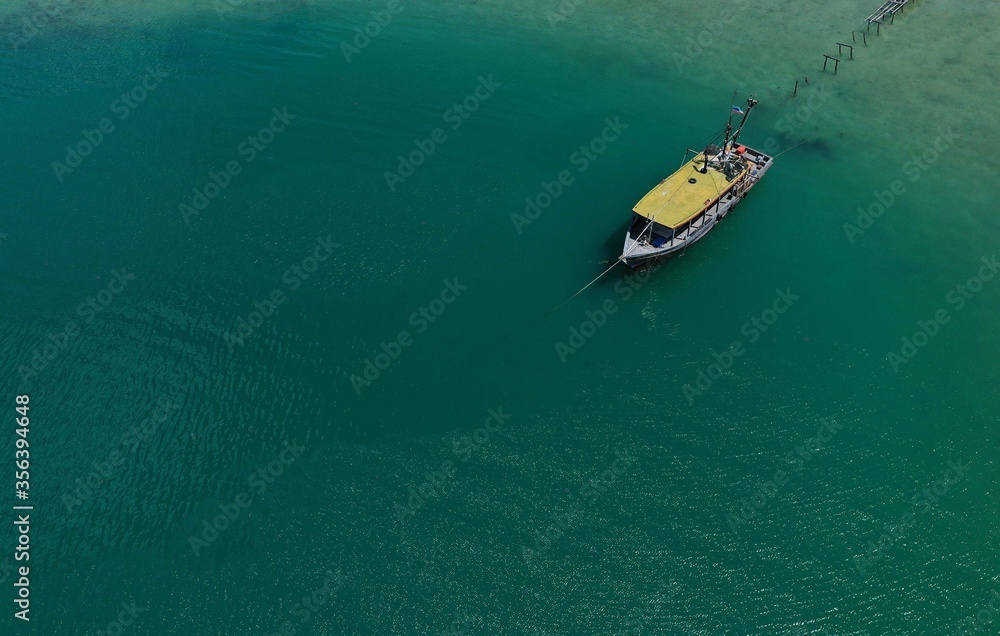 Aerial view on the sea and boat.
