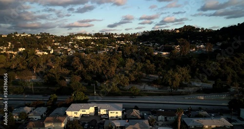 Aerial view tracking left of Freeway-110 Highway, empty with no traffic and beautiful clouds during Coronavirus Covid-19 lockdown in Los Angeles, California, America photo