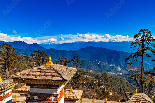 108 Memorial Chortens of Dochula Pass- mountain pass in Himalayas within Bhutan on the road from Thimpu Thimphu to Punakha, Bhutan. photo