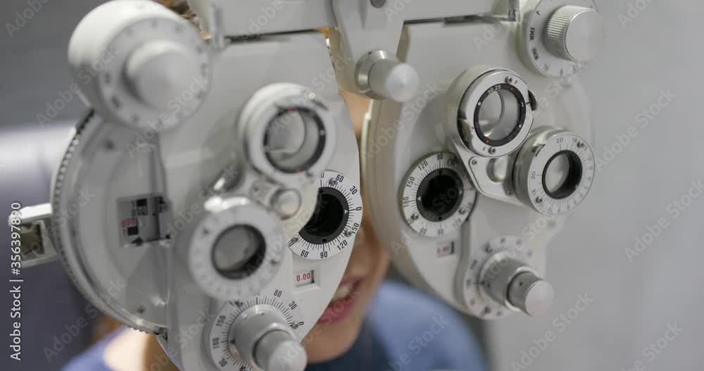Woman check her eye in clinic Woman check her eye in clinic