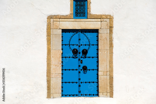 Tunisia, Sidi Bou Said. Typical Traditional door in wood decorated with nails