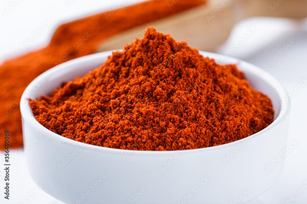 fragrant ground paprika on a white acrylic background fragrant ground paprika on a white acrylic background