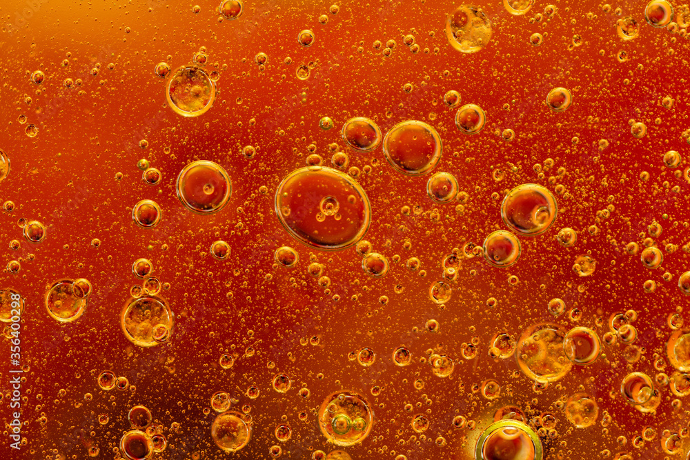 Abstract colorful background with oil drops and waves on water surface Abstract colorful background with oil drops and waves on water surface