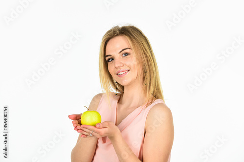 this is for me. healthy food. full of vitamin. organic and natural eating. good for your teeth health. girl smiling with apple isolated on white. dieting idea. forbidden fruit. happy woman hold apple