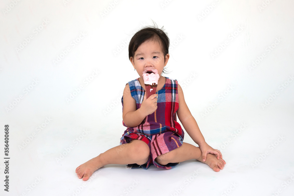 little girl eating ice cream isolated on white little girl eating ice cream isolated on white