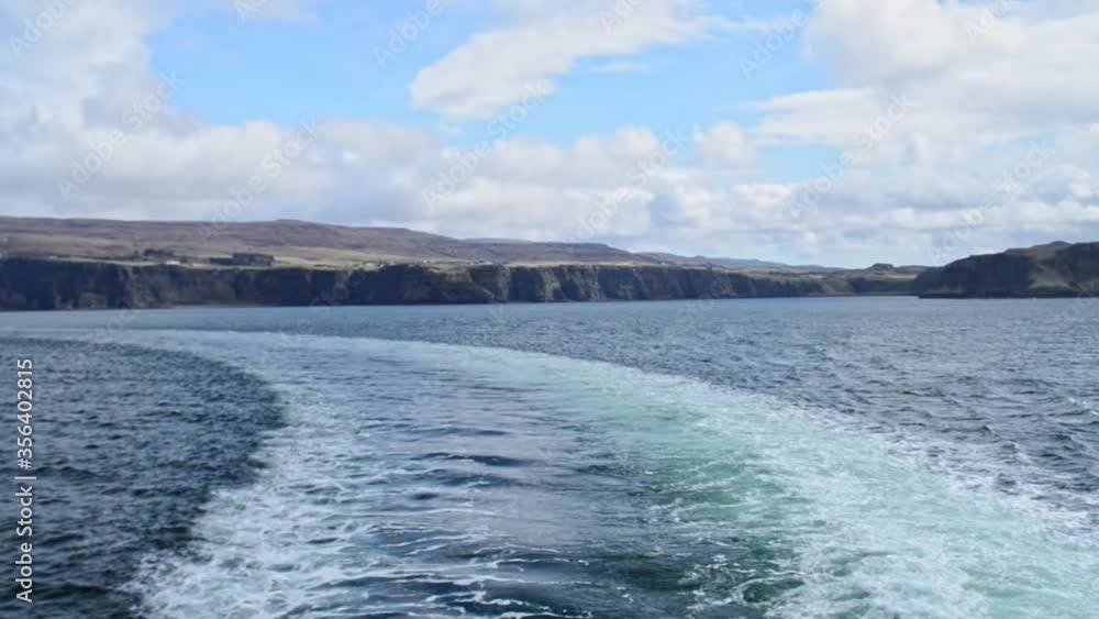 View from a ferry looking ver the isle of skye in the background. Pan left View from a ferry looking ver the isle of skye in the background. Pan left