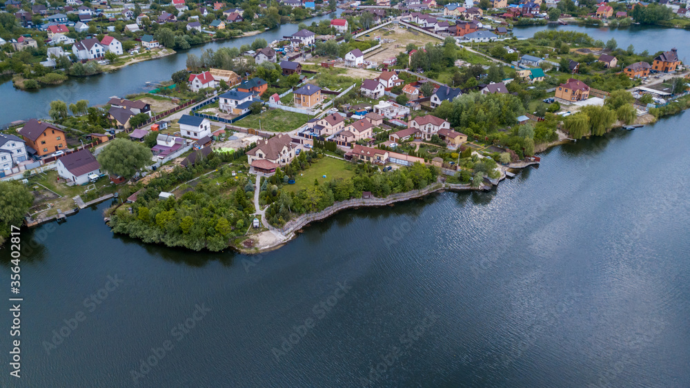 aerial view of cottage town on  lake, sea, river. drone shot.