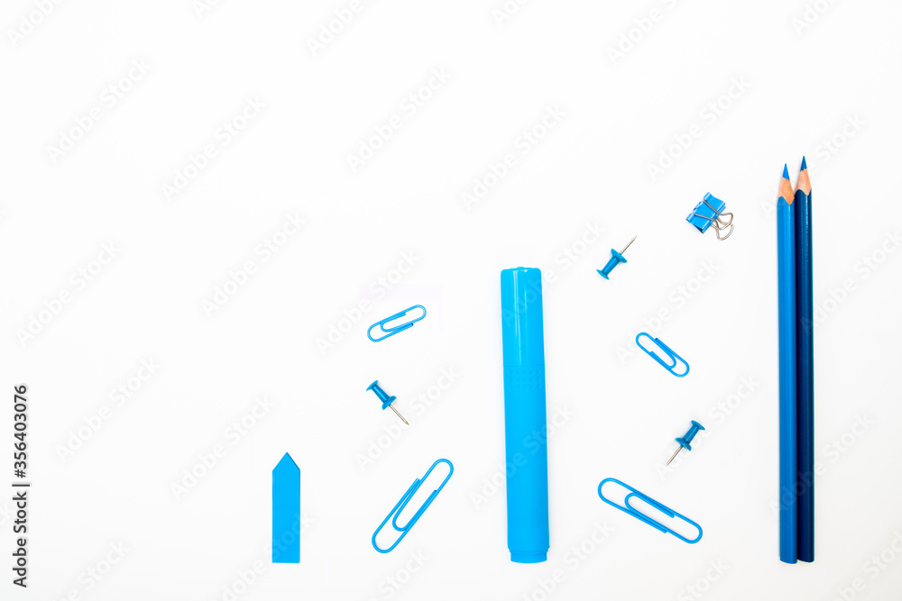 Back to School concept. Top view school supplies and stationery on a student desk on white background. Flat lay and copy space. Back to School concept. Top view school supplies and stationery on a student desk on white background. Flat lay and copy space.
