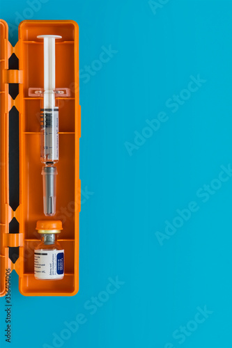 Diabetes. Diabetic coma. Glucagon. Hypoglycemia. Glucagon ampoule. Disposable syringe. A healthy lifestyle diabetic. Blue free background. Shymkent, Kazakhstan May 25, 2020